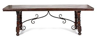 A Spanish Colonial Style Stained Pine and Ironwork Refectory Table Height 30 1/4 x width 95 3/4 x depth 32 inches.