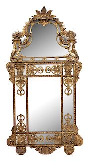 A Louis XIV Style Carved Giltwood Mirror Height 55 x width 28 3/4 inches.