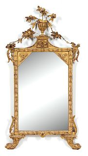 A Louis XV Carved Giltwood Mirror Height 53 x width 28 1/2 inches.