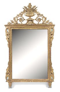 A Louis XVI Carved Giltwood Mirror Height 62 x width 35 1/2 inches.