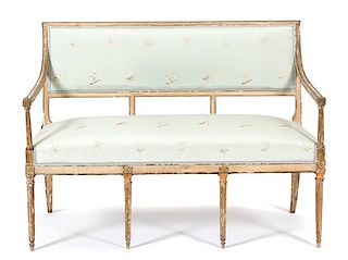 A Louis XVI Painted and Parcel Gilt Settee Height 36 1/4 x width 49 1/2 x depth 24 1/2 inches.