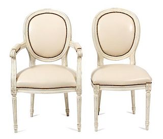 A Set of Twelve Louis XVI Style Painted Oval Back Chairs Height 37 inches.