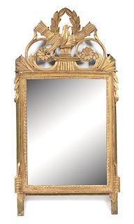 A Louis XVI Style Carved Giltwood Mirror Height 41 x width 21 1/4 inches.