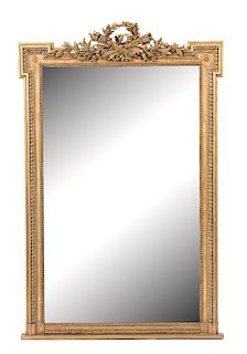 A Louis XVI Style Carved Giltwood Mirror Height 63 1/2 x width 41 inches.