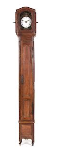 A French Provincial Carved Fruitwood Tall Case Clock Height 112 x width 16 x depth 12 inches.