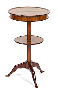 A Georgian Style Inlaid Mahogany Lamp Table Height 29 x diameter 28 inches.