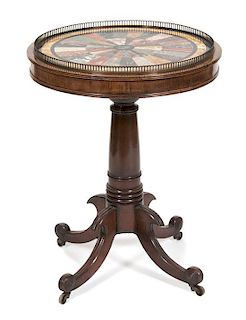 A George III Style Walnut Side Table Height 29 1/2 x diameter 22 3/4 inches.