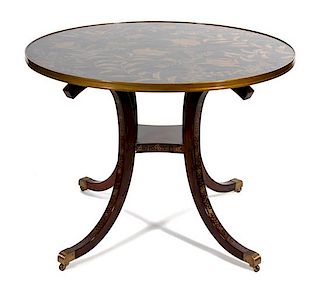 A Regency Style Black and Gilt Lacquer Top Circular Side Table Height 30 1/2 x diameter 40 1/4 inches.