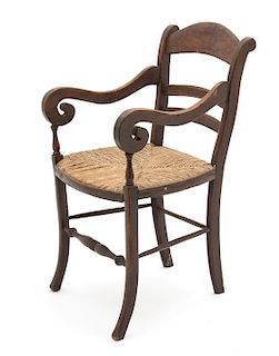 An English Mahogany Ladder Back Rush Seat Miniature Open Armchair Height 15 1/4 inches.