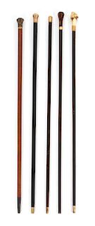 A Collection of Five English Gold Mounted Canes Length of longest 36 inches.