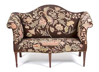 A Chippendale Style Needlework Upholstered Camel Back Love Seat Height 36 1/2 x width 54 x depth 30 inches.