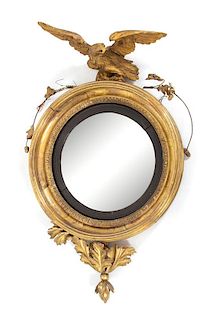 An American Carved Giltwood Convex Mirror Height 31 1/2 inches.
