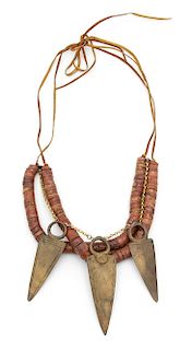 Irena Corwin, (American, 20th Century), Necklace of Lake Chad marble beads with three bronze finger daggers, on leather cord.
