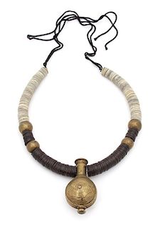 Irena Corwin, (American, 20th Century), Necklace with a Nigerian snuff bottle on a collar of coconut shell discs, bronze beads a