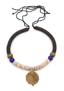 Irena Corwin, (American, 20th Century), Necklace with a Turtle Senufo in the center of a collar composed of white seashell discs