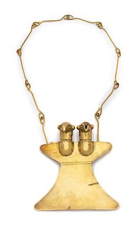 An Incan Hand Wrought Brass Double-Headed Bird Breast Plate/Pendant Height 4 1/2 x width 4 1/4 inches.