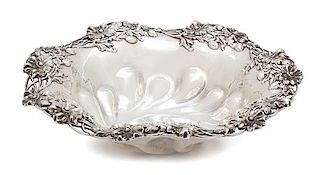 * An American Silver Repousse and Reticulated Bowl, 20th Century, having gadroon base with out-turned rim and pierced floral rim