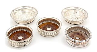 Five Silver Plate Bottle Coasters Diameter of largest 7 inches.