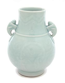 A Celadon Glazed Hu Vase with Conch Double Handles Height 7 1/2 inches.