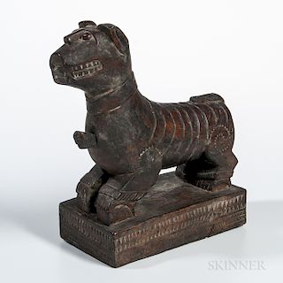 Batak Lion Effigy Figure, Biang-biang, standing on a raised rectangular block with four truncated bent legs, and supporting an elongate