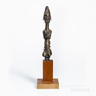 Kneeling Bronze Female Figure, Nigeria, possibly a finial figure from a staff, ht. 9 in.Provenance: Private collection, New York City.
