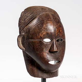 Tabwa Face Mask, Democratic Republic of the Congo, anthropomorphic face mask with cutout mouth and eyes, triangular nose, and protrudin