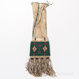 Lakota Beaded Hide Pipe Bag, fourth quarter 19th century, the soft hide bag beaded with geometric designs on two different colored back