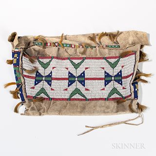 Plains Beaded Hide Possible Bag, Lakota, fourth quarter 19th century, beaded on the front, sides, and flap with multicolored geometric