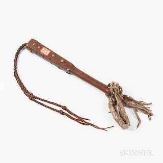 Plains Tacked Wood Quirt, third quarter 19th century, tack-decorated, with hide and animal skin wrist strap and plaited leather strips,