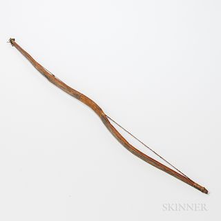 Plains Sinew-backed Wood Bow, c. early fourth quarter 19th century, double curved bow with sinew strapping and original twisted sinew s