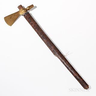 Plains Wood and Brass Pipe Tomahawk, fourth quarter 19th century, the ovoid wood handle pierced for smoking, with file brand decoration