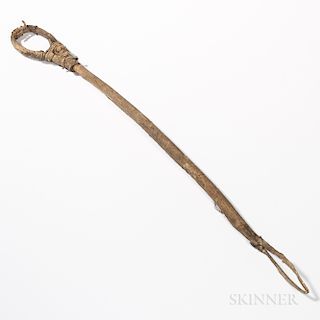 Eastern Plains Lacrosse Stick, late 19th century, hide-wrapped wood stick, (netting gone), lg. 21 in.Provenance: Deaccessioned from the