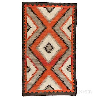 Navajo Rug, c. early 20th century, with a multicolored concentric diamond design on a variegated background, bold zigzag border, natura