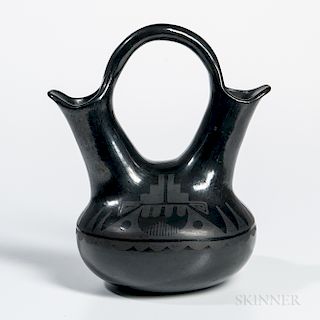 Southwest Black-on-black Pottery Vessel, San Ildefonso, double spout with handle, unsigned, ht. 9 3/4 in.Provenance: Deaccessioned from