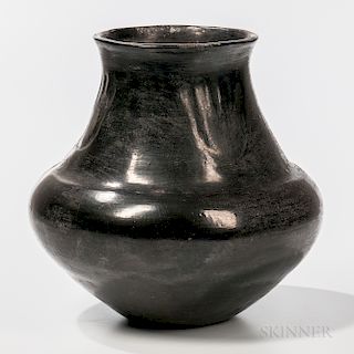 Southwest Blackware Polished Vessel, San Ildefonso, unknown maker, black polished with long neck, flared rim and three bear paw imprint