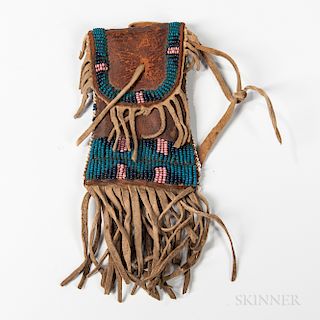 Plains Beaded Commercial Leather Strike-a-Lite Pouch, Cheyenne, fourth quarter 19th century, the hourglass form beaded on the front, wi