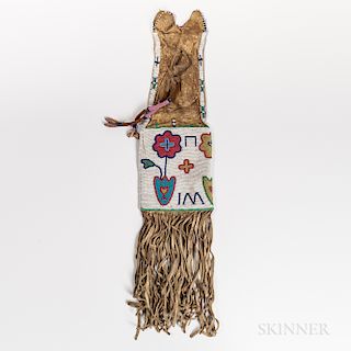Northern Plains Beaded Hide Pipe Bag, Cree, c. 1880s, the tab-top form with beaded panels on both sides decorated with multicolored flo