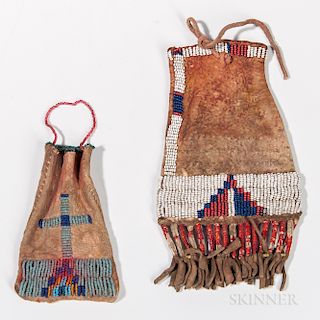 Two Northern Plains Beaded Hide Paint Bags, Sioux, c. 1890s, the smaller with simple beaded designs on both sides with beaded handle an