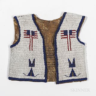 Lakota Beaded Hide Pictorial Vest, c. fourth quarter 19th century, beaded on front and back with bold geometric designs and four flags
