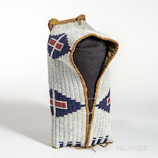 Cheyenne Beaded Cloth and Hide Model Cradle Cover, fourth quarter 19th century, mounted on a wood slat framework showing traces of yell