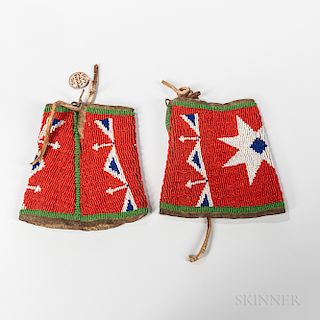 Pair of Plains Beaded Hide Cuffs, Lakota, last quarter 19th century, hide-backed beaded cuffs with star motifs, old tag reads "Sioux In