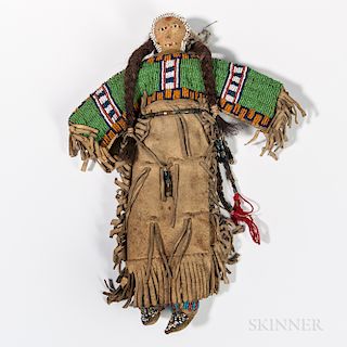 Plains Indian Beaded Hide Doll, c. 1900, Lakota, hide dress heavily fringed, with beaded yoke, a ring of white beads on the head and be