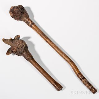 Two Northeast Carved Wooden Clubs, Penobscot, fourth quarter 19th century, the shorter with chip-carved fern designs and root-ball head