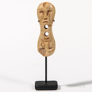 Double Face Toggle, Inuit, Alaska, 19th century, walrus ivory, probably used as a garment toggle, lg. 2 3/4 in.Provenance: Private coll