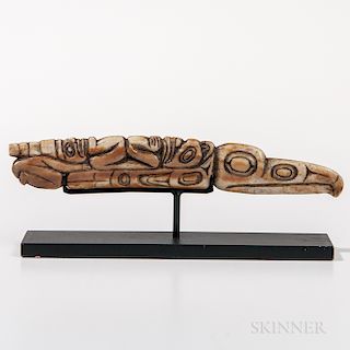 Northwest Coast Shaman's Amulet, Kwakwaka'wakw (Kwakiutl), fourth quarter 19th century, walrus tusk carved in the form of a raven wit