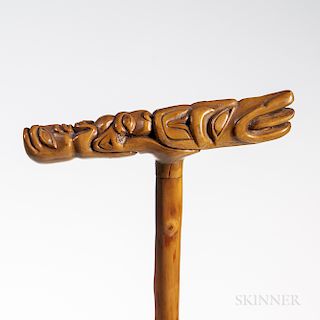 Northwest Coast Walking Stick, Tlingit, c. 1890s, in two parts, the handle completely carved with three zoomorphic animals, lg. 33, wd.