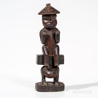 Northwest Coast Mortuary Figure, Tlingit, fourth quarter 19th century, a bear wearing a clan hat sits on a box, which in turn rests on