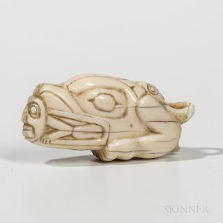 Northwest Coast Amulet, Tlingit, fourth quarter 19th century, depicting a human in the mouth of a killer whale, another person rests on