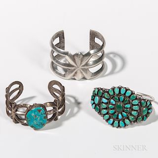 Three Southwest Silver and Turquoise Bracelets, one silver sand cast bracelet, the second sand cast with large turquoise stone, the thi