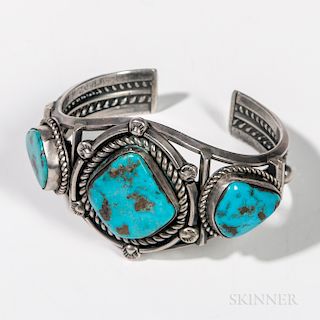 Navajo Silver and Turquoise Bracelet, with three settings surrounded by silver twisted rope work, dia. 2 3/8 in.